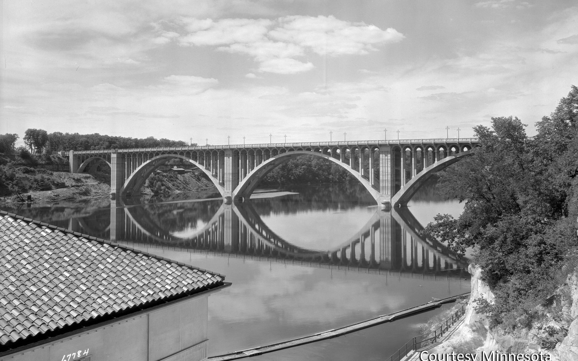 The Intercity Bridge, better known as the Ford Bridge, was completed in 1927, connecting the growing Longfellow neighborhood of Minneapolis to the area around the new Ford plant. Courtesy Minnesota Historical Society