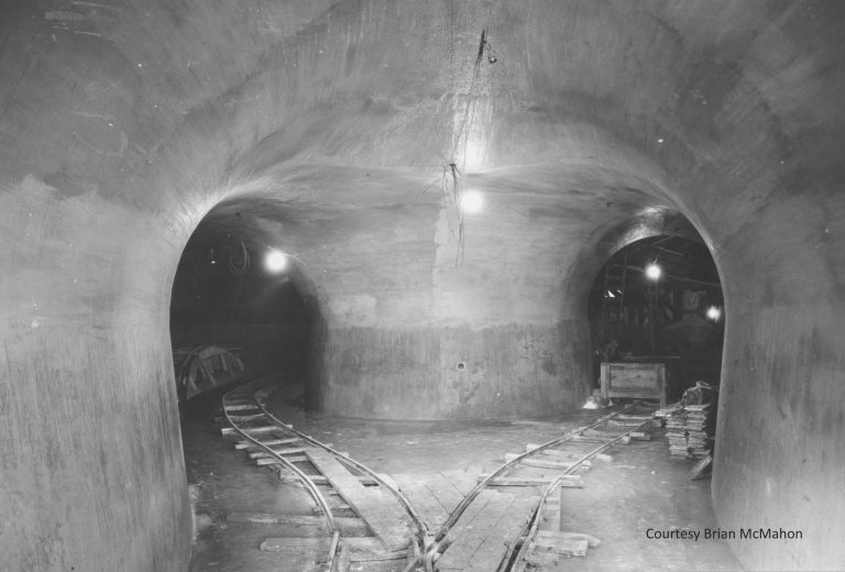 Tunnels were constructed approximately 100 feet below the surface to facilitate the mining of silica sand for the glass plant. Other tunnels were built for the steam pipes that connected the steam plant to the assembly plant, and for the electrical cables connecting the hydroelectric plant to the main plant. Traffic tunnels enabled finished vehicles to be transported out to the wharf. Courtesy Brian McMahon